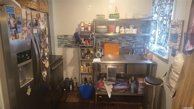 interior space with sink and hardwood / wood-style flooring