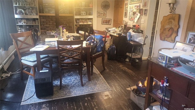 dining area with dark hardwood / wood-style floors