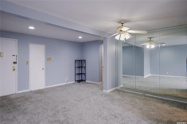 spare room with ceiling fan and carpet floors