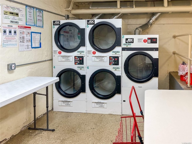 laundry area featuring stacked washer and dryer