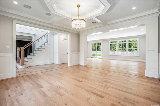 unfurnished living room featuring coffered ceiling, light wood-type flooring, ornamental molding, a notable chandelier, and beam ceiling