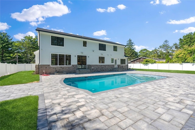 view of swimming pool with a patio