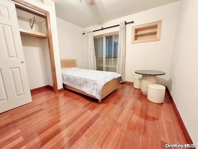 bedroom featuring a closet and hardwood / wood-style floors