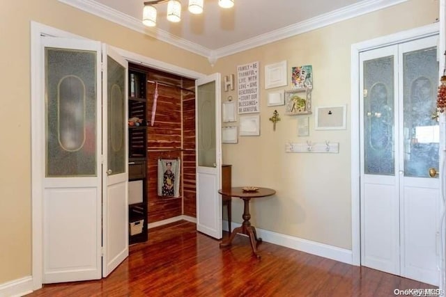 corridor featuring dark hardwood / wood-style floors and crown molding