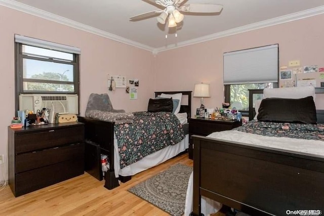 bedroom featuring ceiling fan, light hardwood / wood-style floors, and ornamental molding