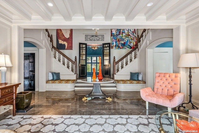 entryway featuring beamed ceiling and crown molding