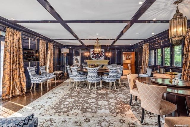 dining room featuring beam ceiling, coffered ceiling, and an inviting chandelier