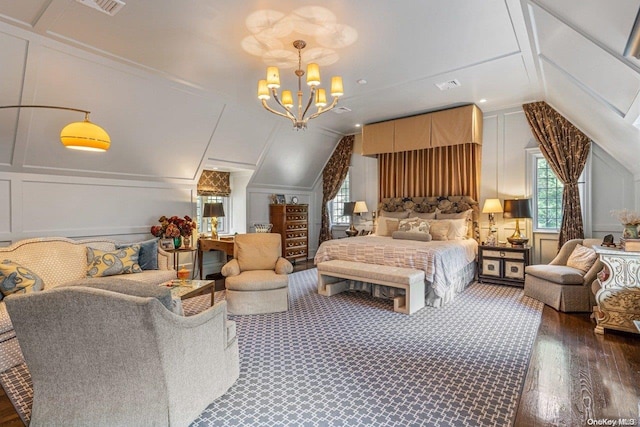 bedroom featuring dark hardwood / wood-style floors, vaulted ceiling, and a chandelier