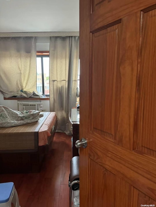 bedroom featuring dark hardwood / wood-style flooring