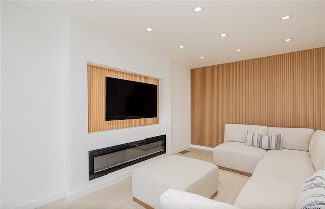 living room with light hardwood / wood-style flooring