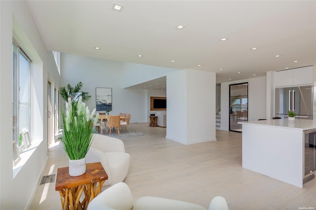 living room with light hardwood / wood-style flooring