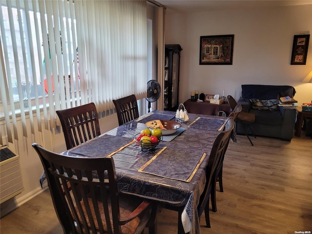 dining space featuring hardwood / wood-style flooring