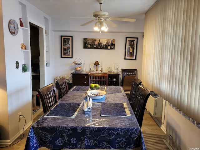 dining space with ceiling fan and light hardwood / wood-style flooring