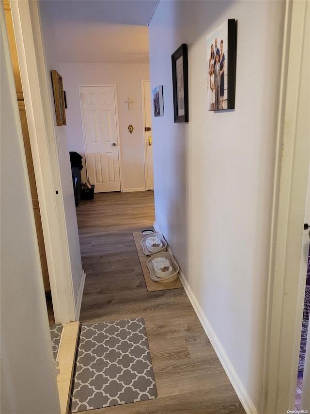 corridor with light wood-type flooring