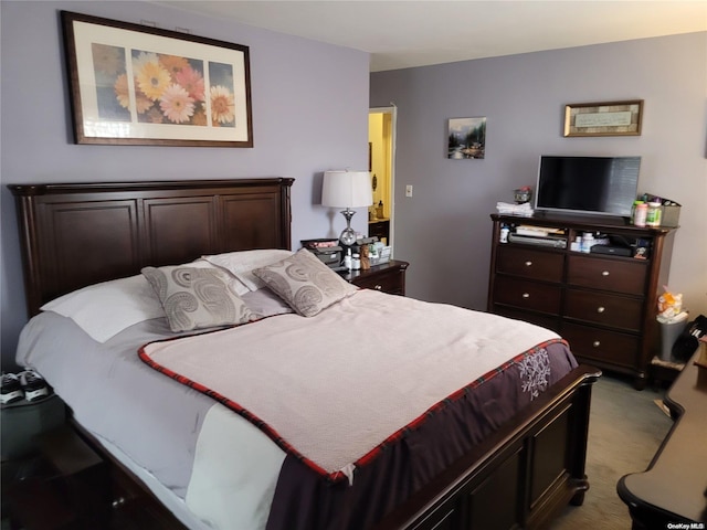 bedroom with light colored carpet