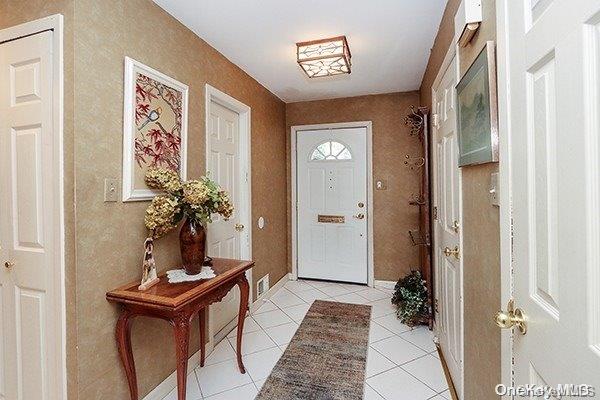 view of tiled entrance foyer