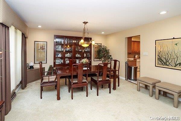 view of carpeted dining area