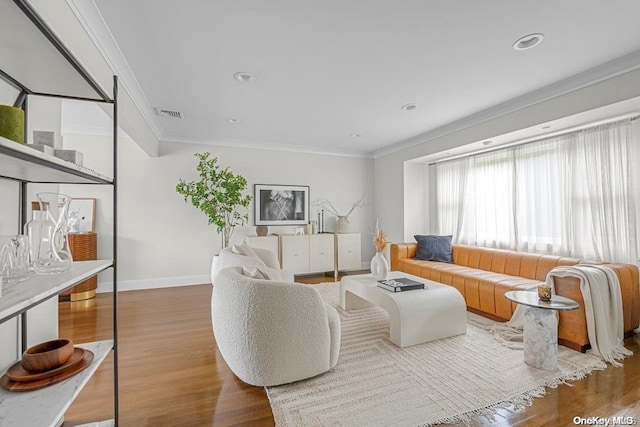 living room featuring hardwood / wood-style floors and ornamental molding