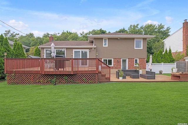 back of property featuring outdoor lounge area, a yard, and a wooden deck