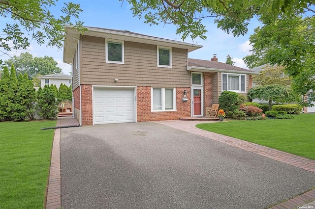 tri-level home featuring a front lawn and a garage