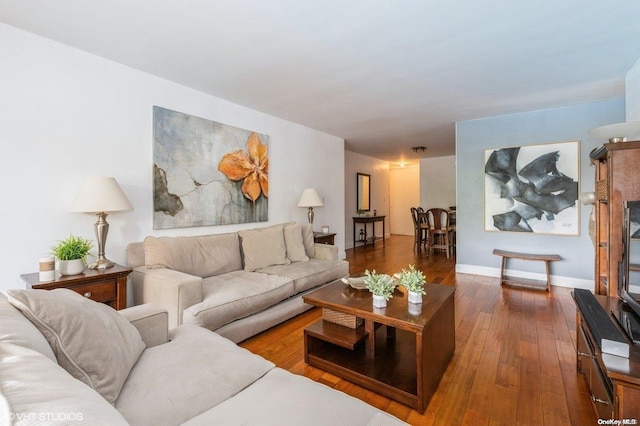 70-25 Yellowstone Blvd Unit 2T, Forest Hills, NY 11375 - living room featuring dark wood-type flooring and baseboards