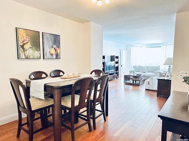 70-25 Yellowstone Blvd Unit 2T, Forest Hills, NY 11375 - dining space featuring wood finished floors and baseboards