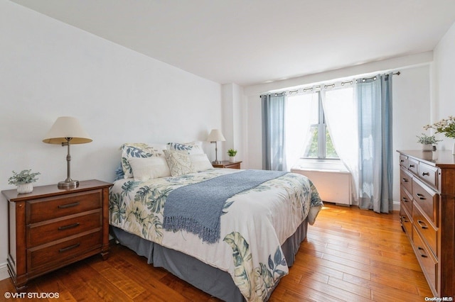 bedroom with wood-type flooring