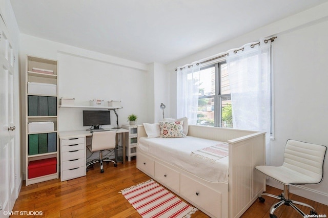 bedroom with wood-type flooring