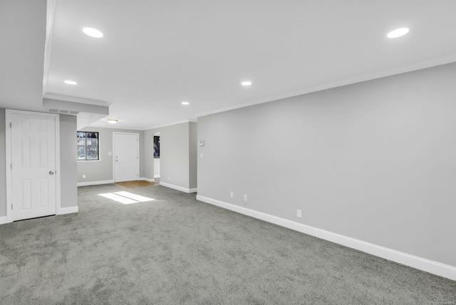 basement featuring crown molding and carpet flooring