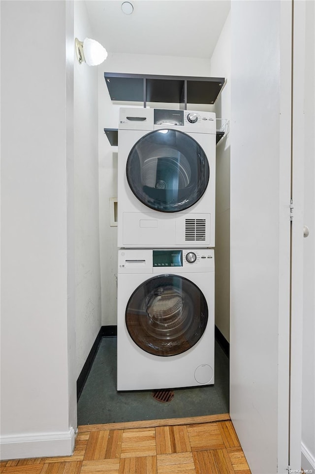 laundry area with stacked washer / dryer