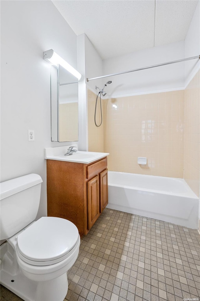 full bathroom with vanity, toilet, and tiled shower / bath