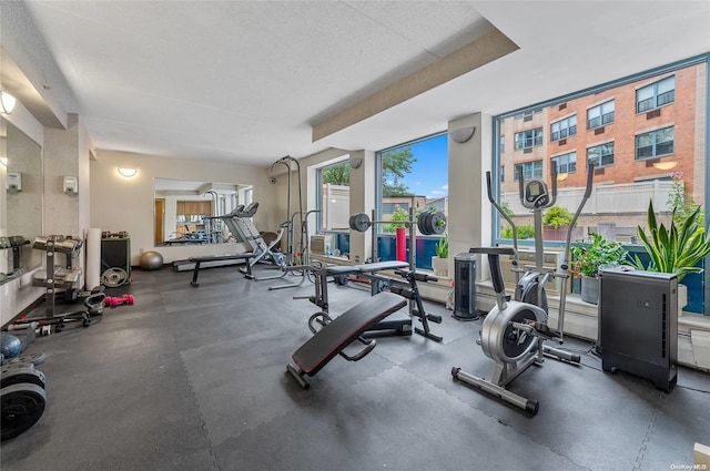 workout area featuring a textured ceiling