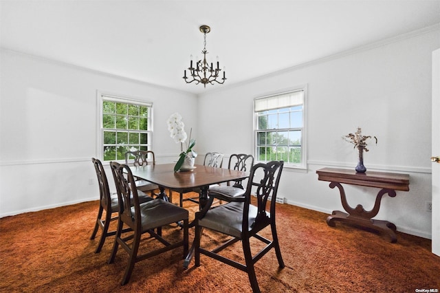 dining space featuring plenty of natural light, crown molding, and an inviting chandelier