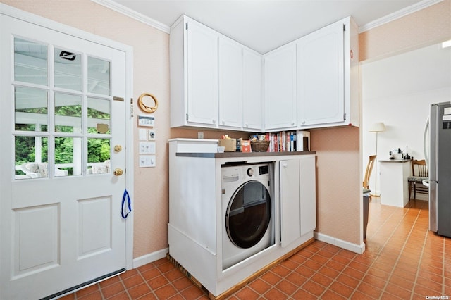 laundry area with washer / clothes dryer, tile patterned flooring, cabinets, and ornamental molding