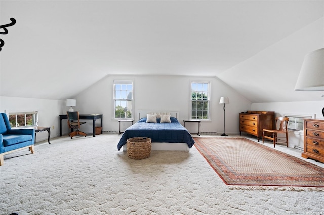 bedroom with carpet flooring and vaulted ceiling