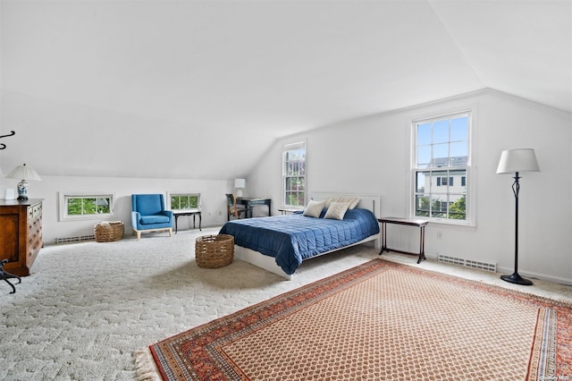 bedroom featuring carpet flooring and lofted ceiling