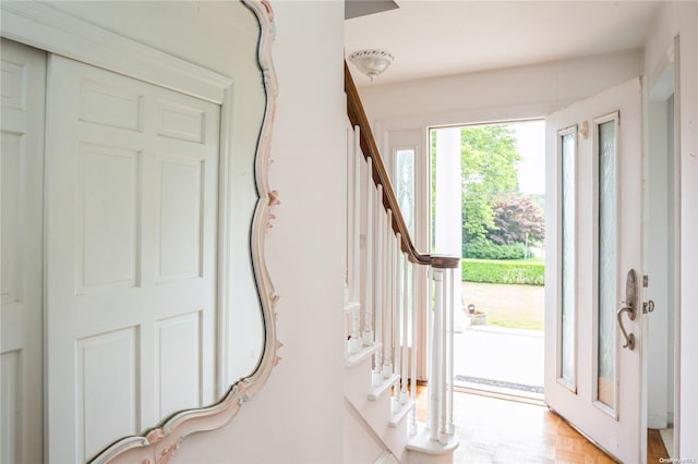 foyer entrance featuring light parquet flooring