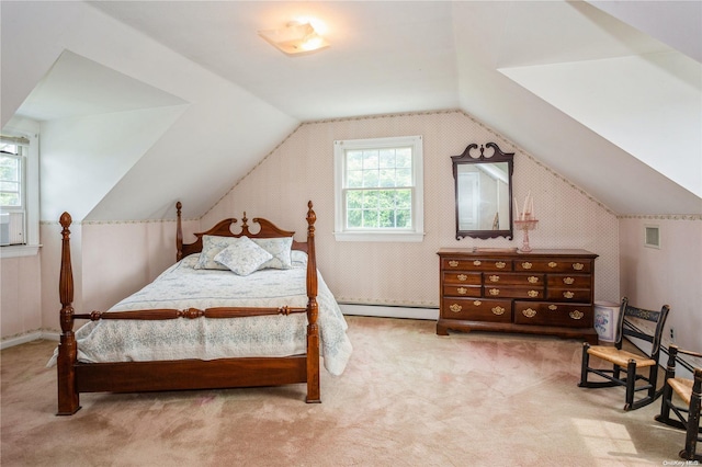 carpeted bedroom with baseboard heating and lofted ceiling