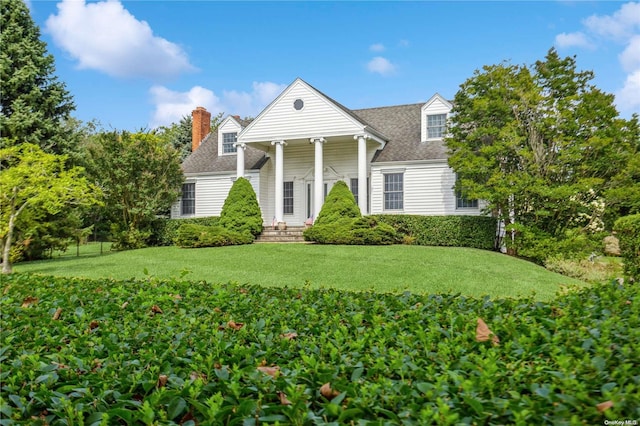 view of front of home with a front lawn