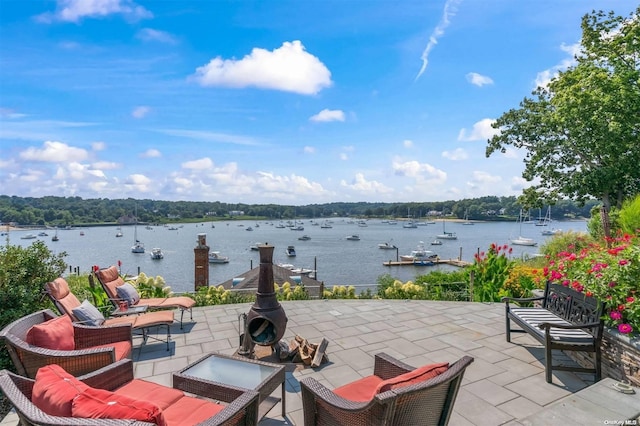 view of patio with a water view