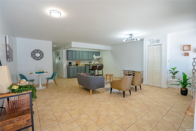 tiled living room with a chandelier