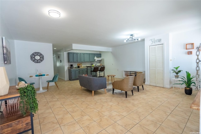 tiled living room featuring a chandelier