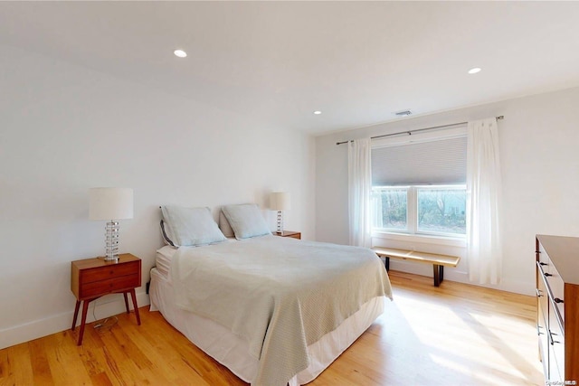 bedroom with light hardwood / wood-style floors