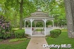 view of property's community featuring a gazebo and a lawn