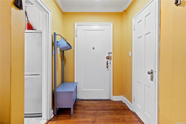 entryway with hardwood / wood-style floors