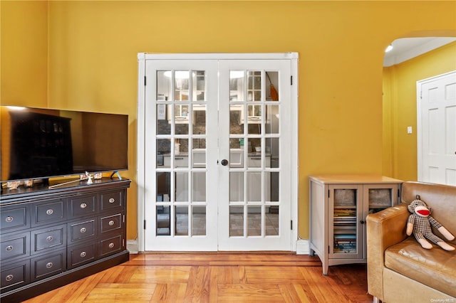 entryway featuring french doors and light parquet flooring