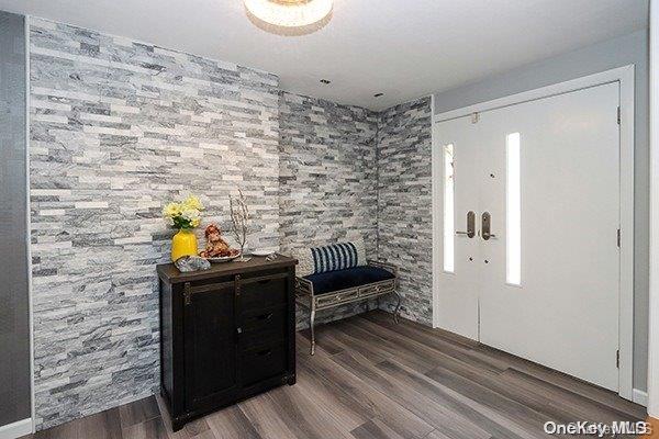 foyer entrance with dark hardwood / wood-style flooring