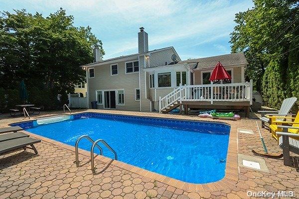 view of swimming pool featuring a wooden deck