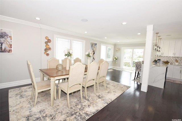 dining area with dark wood-type flooring and ornamental molding