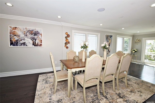 dining area with dark wood-type flooring and ornamental molding